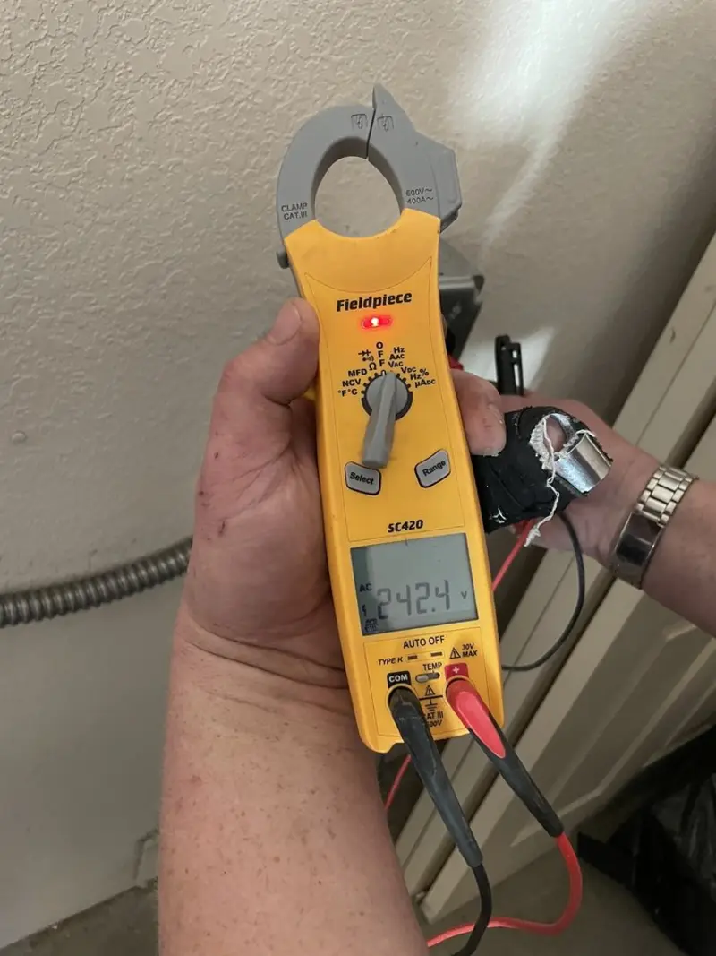 Voltage testing with clamp meter during Circuit Breaker Repair in Trophy Club